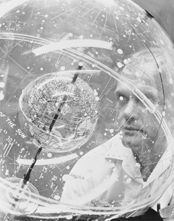 (1961) Mercury astronaut John H. Glenn Jr. looks into a Celestial Training Device (globe) during training in the Aeromedical Laboratory at Cape Canaveral, Florida.