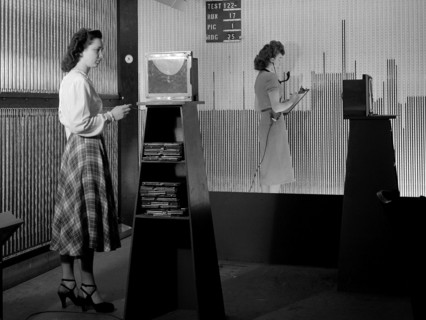 Female computers at the National Advisory Committee for Aeronautics (NACA) Lewis Flight Propulsion Laboratory copy pressure readings from rows of manometers below the 18- by 18-inch Supersonic Wind Tu...