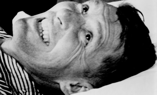 Astronaut Walter Schirra smiles during post-flight physcial