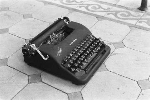 A typewriter on a tile floor; Brand Smith Corona; Date May 1947 Location Indonesia, Dutch East Indies