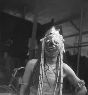 Dancer with mask during a slamatan in a pen topo - Indonesia, Madura, Dutch East Indies ca. 1947