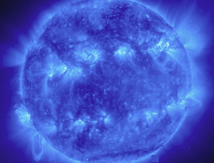 This EIT 171 image shows a wide variety of loops and active regions (lighter areas on the surface). Taken on November 9, 1998. The 171 filter shows emission from 8 and 9 times ionized iron at about 1 ...