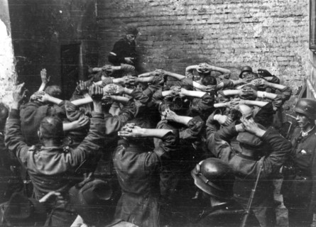 Warsaw Uprising: German POW’s taken in PAST-a building in a courtyard of a townhouse on Zielna street ca. August 1944