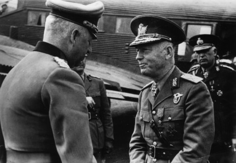 Marshal Erich von Manstein, German commander of the Wehrmacht, Nazi Germany's armed forces during the Second World War (left) welcomes Marshal Ion Antonescu to the field airfield. In the background, a...