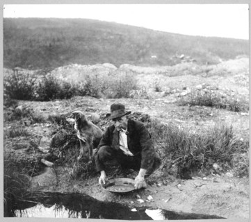Miner panning gold 1916