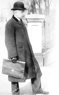George B. Cortelyou carrying briefcase