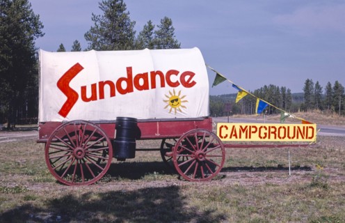 1980s United States -  Sundance Camp Ground sign and Wagon, Route 2, Coram, Montana 1987