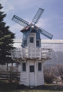 1980s United States -  Windmill at Feed Mill, Prairie City, Iowa 1980