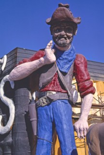 1980s United States -  Spray Trucks foam, prospector statue detail, Frontage Road I-5, Albany, Oregon 1987