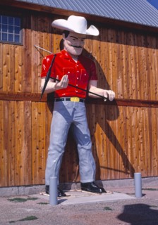 1980s United States -  Cowboy statue, Genine Stamper Jewelry, Route 16, Rapid City, South Dakota 1987