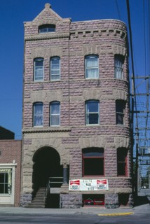 1980s United States -  Yankton National Bank, Keley's Bar, front, car at right, Third Street, Yankton, South Dakota 1987