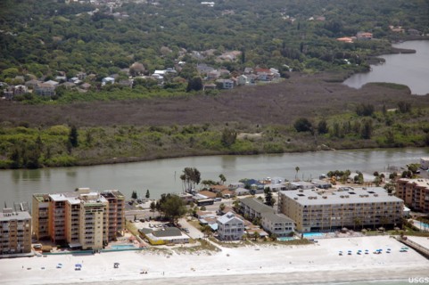 Florida's mangrove forests were hard hit by the uncommonly cold temperatures in January, 2010. Here, a dull brown swath of freeze-damaged mangroves cuts across the photograph, Pinellas County, FL -  c...