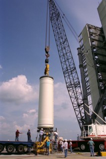 Workers erect the first stage of a Lockheed Martin Launch Vehicle-2 (LMLV-2) at Launch Complex 46 at Cape Canaveral Air Station, Fla ca. 1997