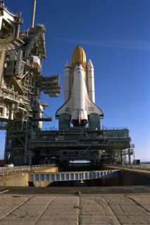 Atop the crawler/transporter, the Space Shuttle orbiter Atlantis rolls out to Launch Complex 39A in preparation for mission STS-86 ca. 1997