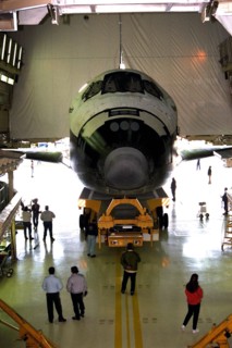 The orbiter Atlantis rolls out of the Orbiter Processing Facility at Kennedy Space Center (KSC) for its journey to the Shuttle Landing Facility ca. 1997