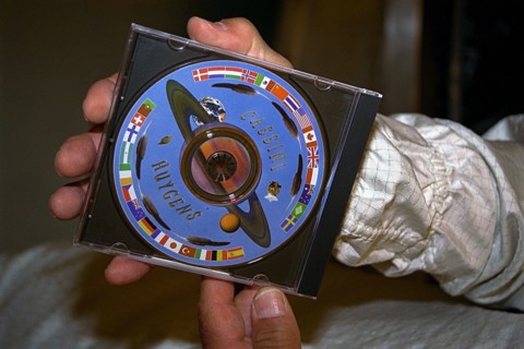 In the Payload Hazardous Servicing Facility (PHSF), a Digital Video Disk (DVD) bearing 616,400 digitized signatures of people from nations around the world is attached to the Cassini spacecraft ca. 19...