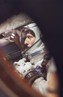 (21 Aug. 1965) --- View of astronaut Charles Conrad Jr. through the window as he sits in the Gemini-5 spacecraft during preflight activities