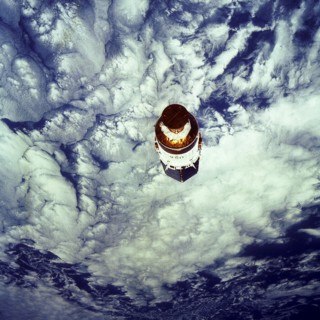 1991 - The free-flying Tracking and Data Relay Satellite-E (TDRS-E), still attached to an Inertial Upper Stage (IUS), was photographed by one of the crewmembers during the STS-43 mission.