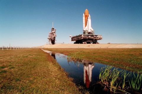 1995 - A massive 19 million pounds-plus (8.6 million kilograms) of Space Shuttle, support and transport hardware inch toward Launch Pad 39A from the Vehicle Assembly Building.