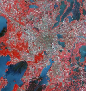 The Landsat TM image was acquired August 4, 1984, and the Aster image was acquired August 2, 2015. The images cover an area of 48 by 53 km, and are located at 31.2 degrees north, 120.4 degrees east.