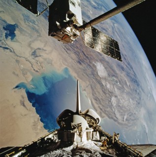 1992 - OV-104's RMS grapples EURECA-1L and holds it in deployment position above PLB