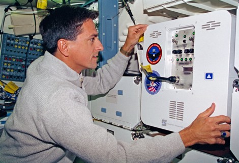 Thomas checks the condition of the MIS-B middeck locker experiment