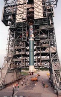 1998 - The first stage of Boeing's Delta 7326 rocket, which will be used to launch the Deep Space 1 spacecraft, is lifted into place above the surface of Pad 17A at Cape Canaveral Air Station.