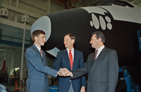 (10 Nov 1992) --- Russian cosmonauts Sergei Krikalev (left), and Vladimir Titov (right) share a team handshake with Kenneth L. Reightler, STS-60 pilot.