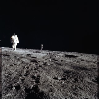 Apollo 12 Mission image - Photo of Al Bean and the TV taken from just inside the rim of Surveyor Crater