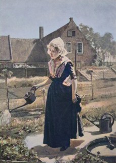 Girl watering in the home garden