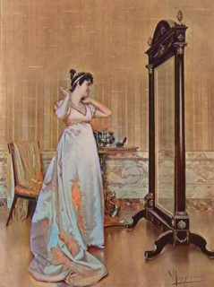 Woman tries a new necklace at home in front of the mirror