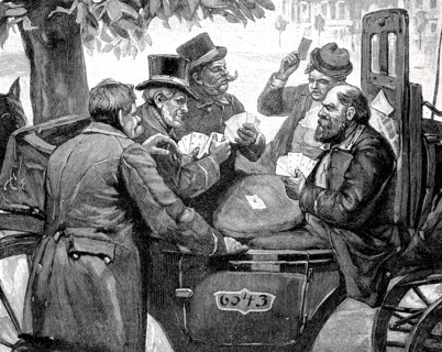 Men playing cards in a carriage