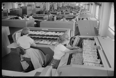 Office workers working with FBI file indexes