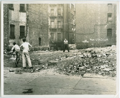 Playing catch outside tenement buildings