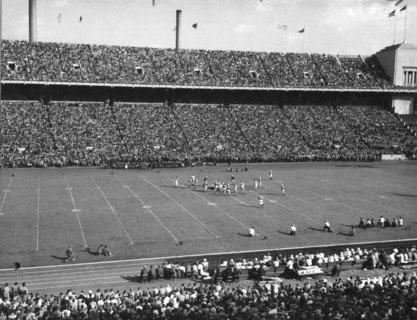 Sixty-three thousand football fans attended the annual game between Ohio State University and the University of Iowa. Columbus, Ohio, 1948.