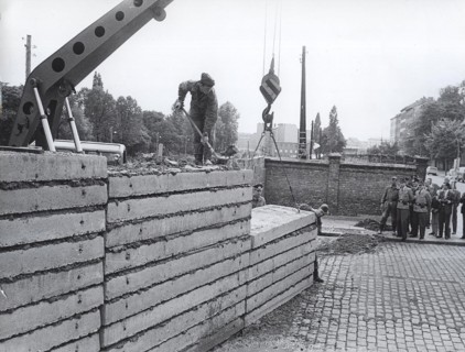 After The Wall Was Damaged at Acker, Corner Bernauerstrasse, Volksarmy Workers Are Fixing The Wall