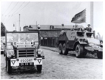 The Dividing Line Actually Runs Between The Two Vehicles. In the Right Background Is Part of the
