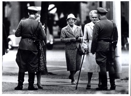 August 1961 - Two 'Vopos' (East German Police) Check East Berliners Seeking to Pass From