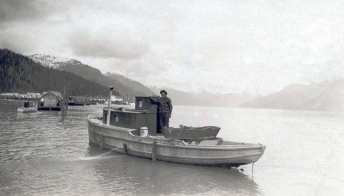 Title: View of Emil Colman aboard his boat on the Skeena River