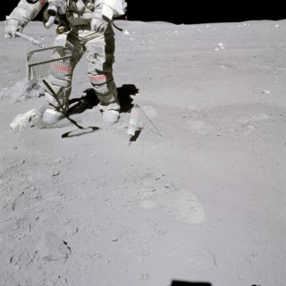 Astronaut John W. Young collects samples