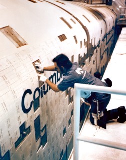 Rockwell International technicians mount ceramic tiles