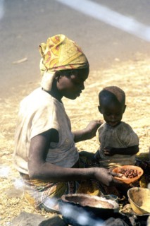 A Rwandan mother feeds her child.  Rwandan refugees entered Goma