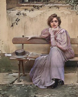 Pretty Woman With Dreamy Look Sitting On A Bench