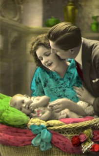 Couple admiring an Infant.