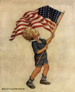 Boy waving American Flag.