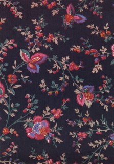 Green leaves and stems with red flowers on dark field.