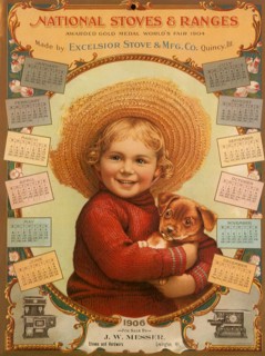 Girl in Straw Hat holds Puppy.