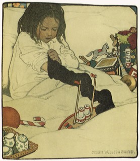 Girl reaches for Toys in Christmas Stocking.