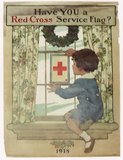 Boy placing Red Cross Service Flag on Window.