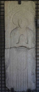 Tombstone with prayer figure in bas-relief